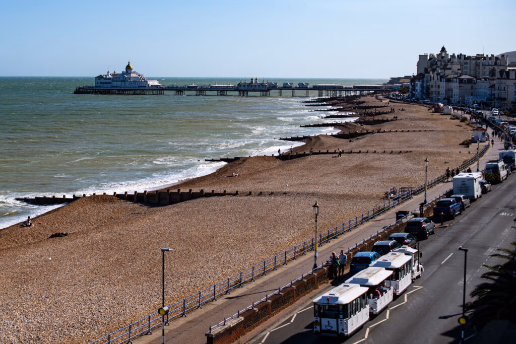 View of Eastbourne Seafront and pier with beach and road in shot